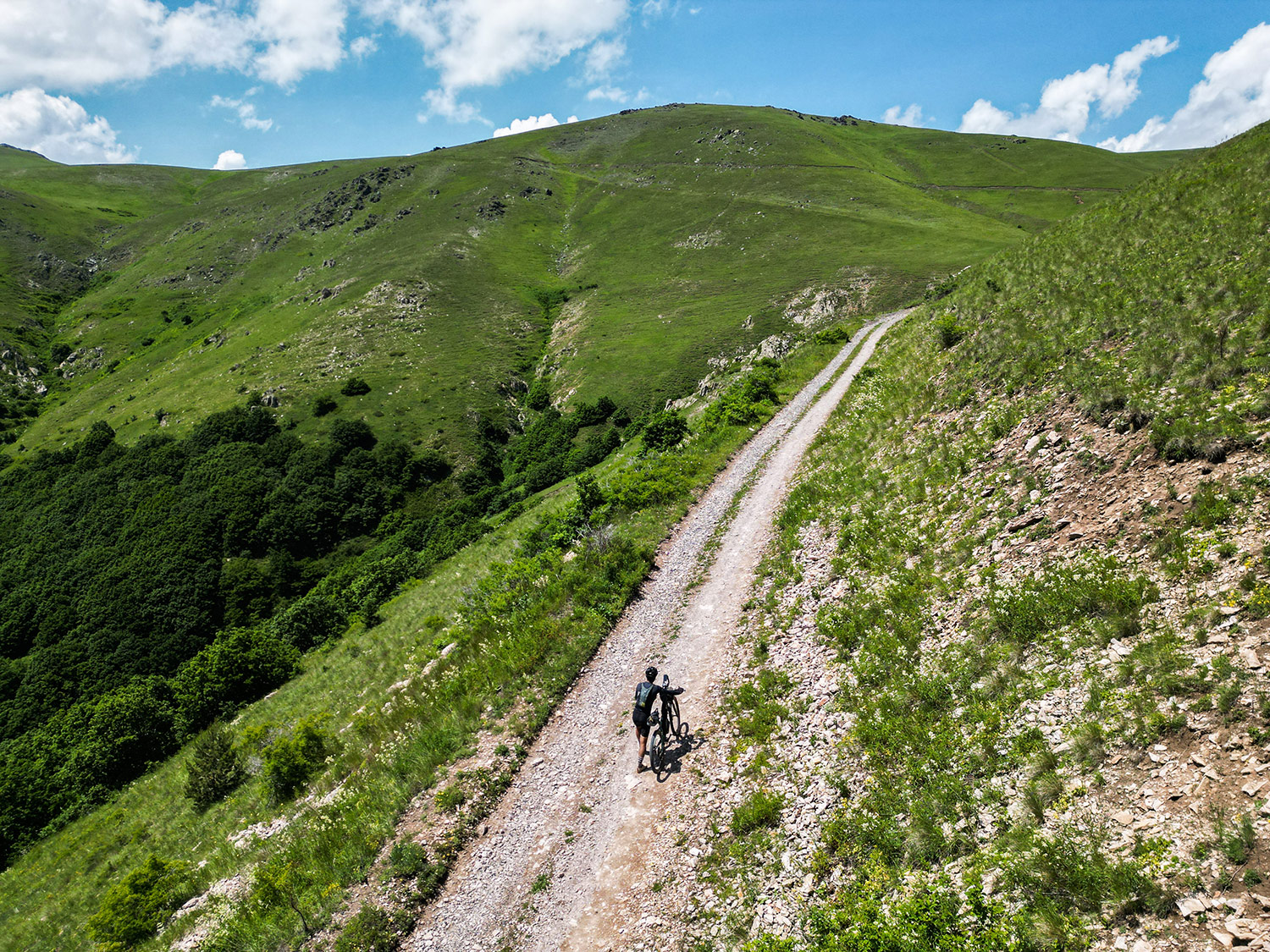 Drone view of cyclists crossing Armenia's rugged terrain