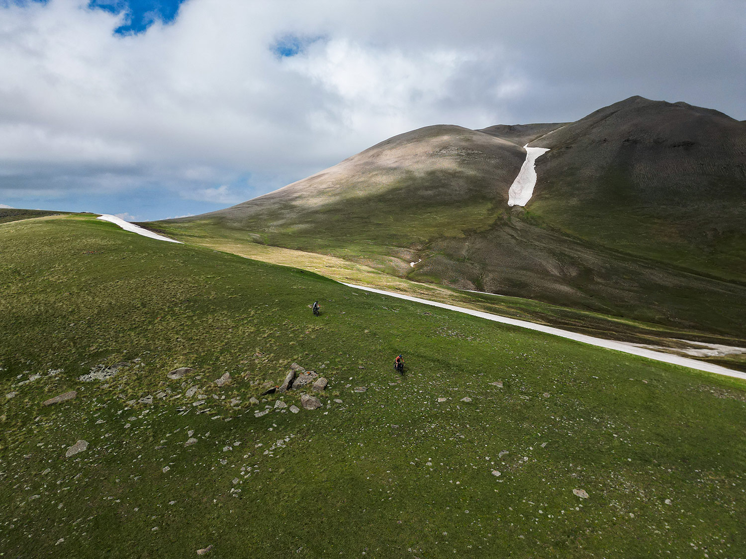 Bikepacker on scenic mountain road in Armenia